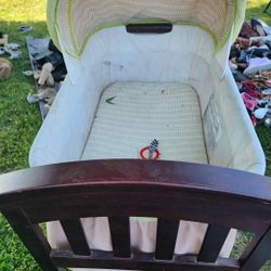 Bassinet,  Wood  Frame with Wheels.