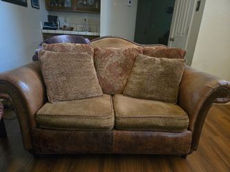 Dark brown leather 2 seater sofa