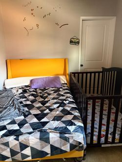 Full size yellow wooden bed frame