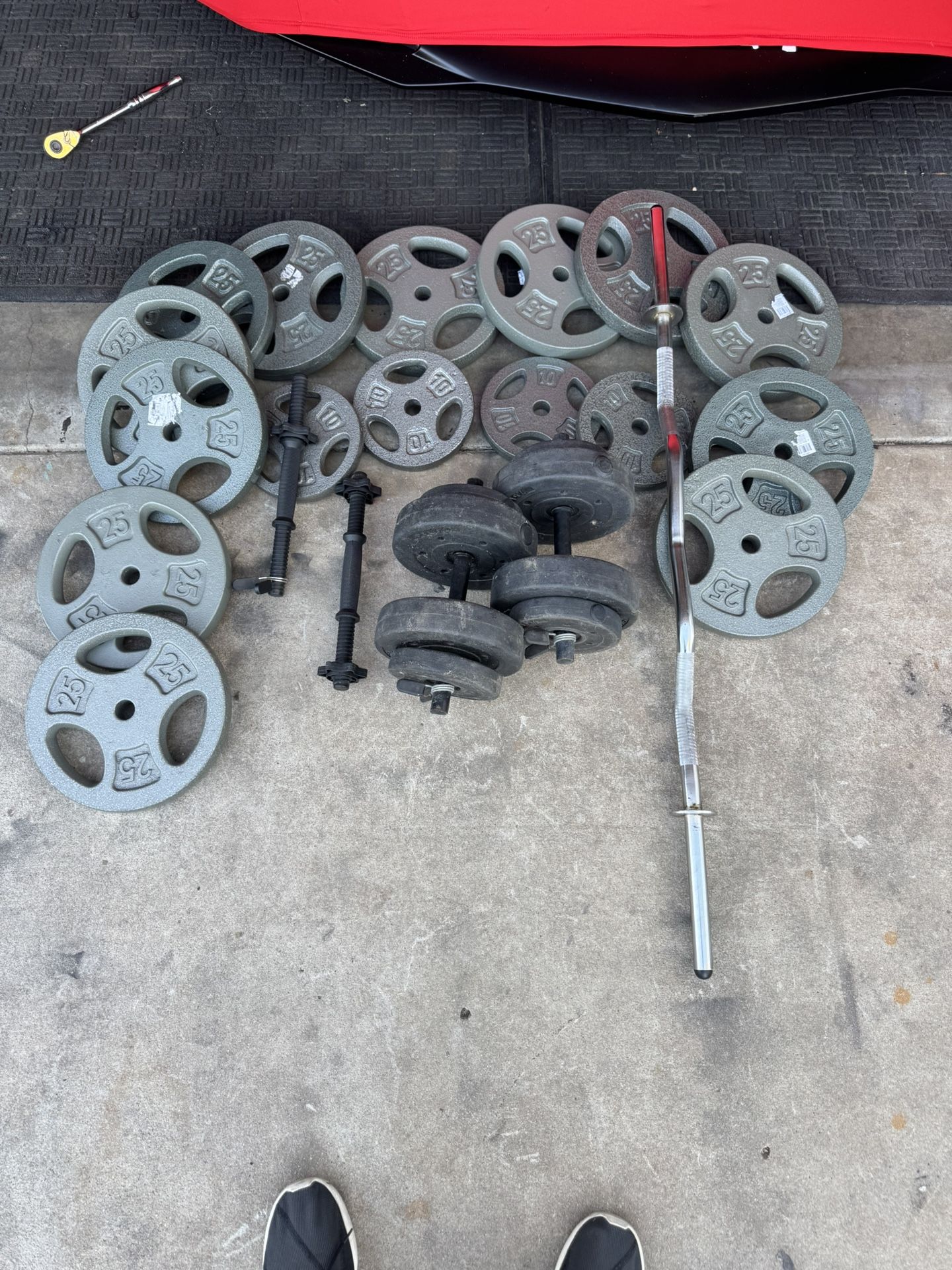 Standard weights 330lbs total plus curl bar and adjustable dumbbells