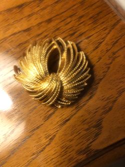 Monet gold tone brooch