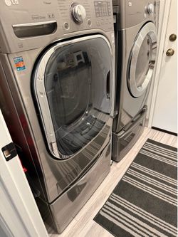Top line LG front load Washer and gas Dryer on pedestal bases