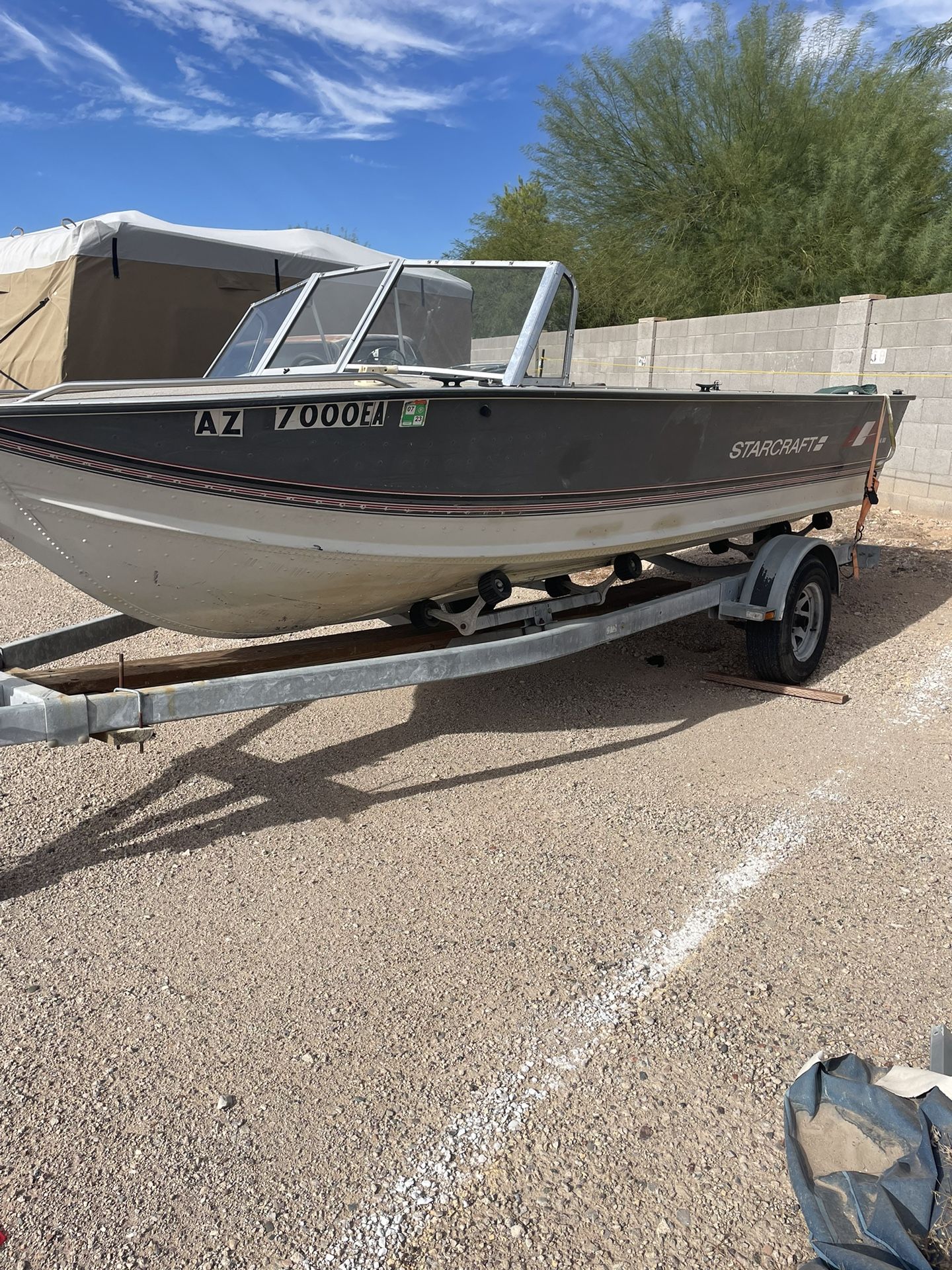 18foot 1989 StarCraft aluminum boat with easy loader trailer 70 HP Evinrude