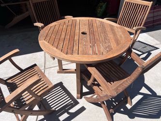 Round teak table and 4 folding teak chairs  Located in concord  Recently cleaned, sanded and teak oiled Ready to use  Teak wood is heavy and sturdy No