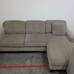 Small brown l-shaped sectional couch