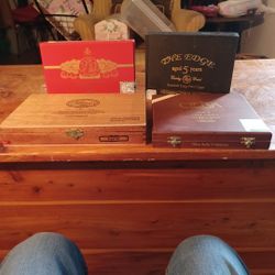 Four Empty Cigar Boxes.