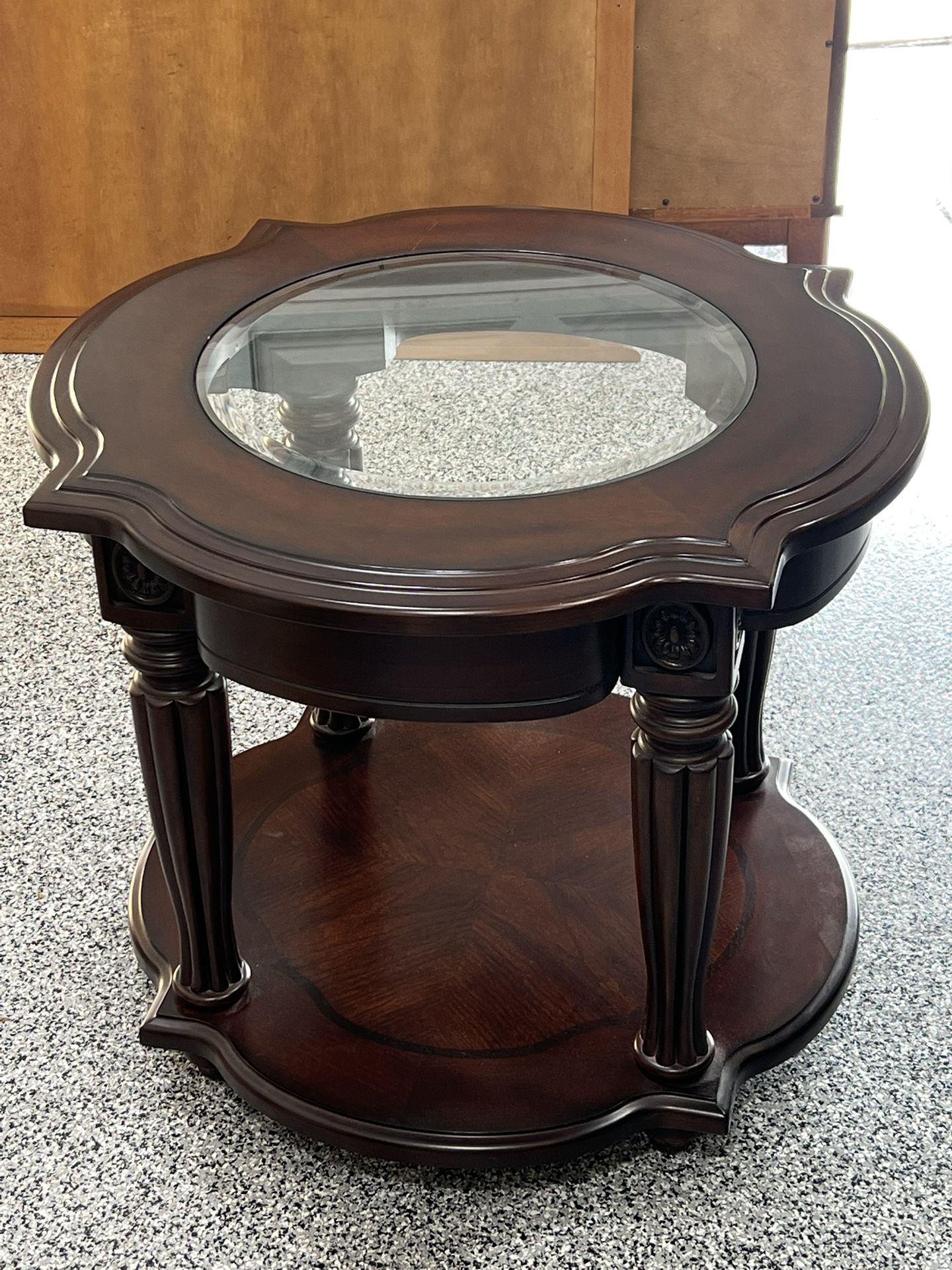  vintage solid wood end table with a round glass top and a bottom storage shelf