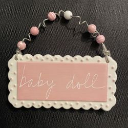 Sandra Magsamen Collectible Tiles. Background Is Pink Writing Is White, Beautiful Beads Adorn.
