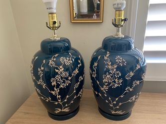 Pair of Vintage 1960s blue ceramic table lamps with floral decoration.