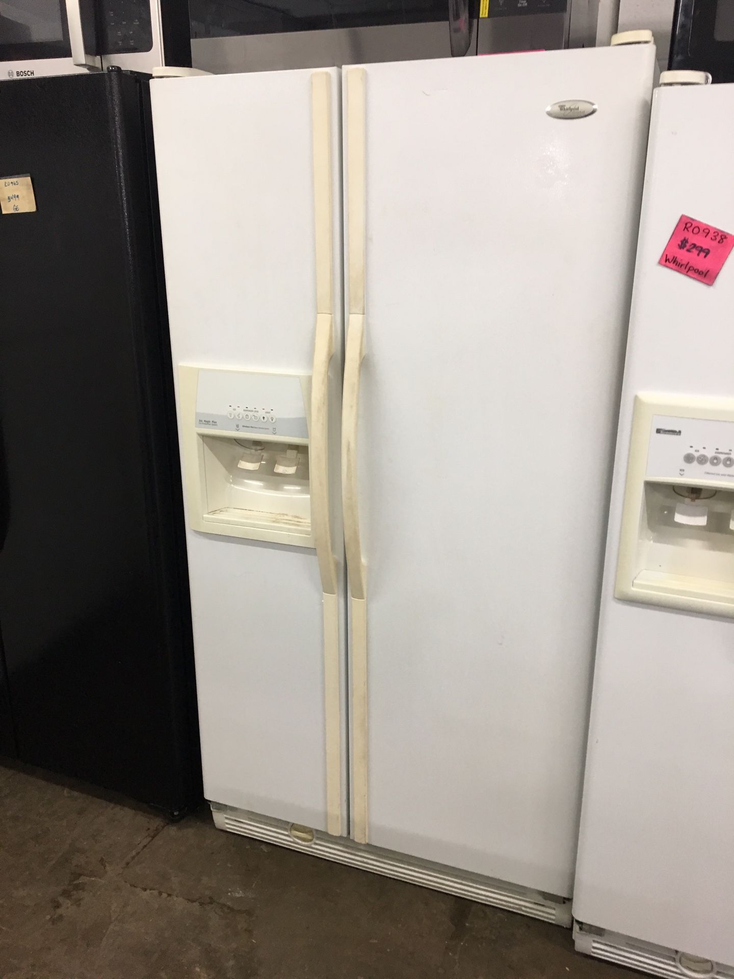 Guaranteed Refurbished White side-by-side refrigerator with water and ice dispenser