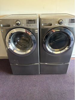 LG front load washer and matching electric dryer.