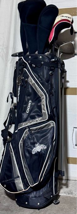 New golf clubs in bag.