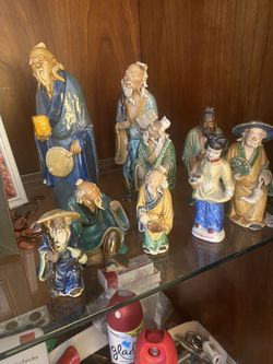 Small Asian male Statues