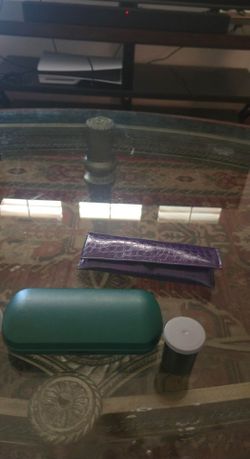 Two Glasses Cases And Glasses Cleaner