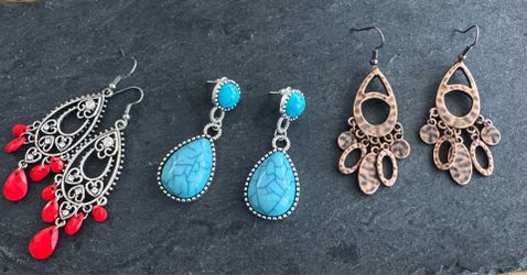 Trio of dangle costume earrings