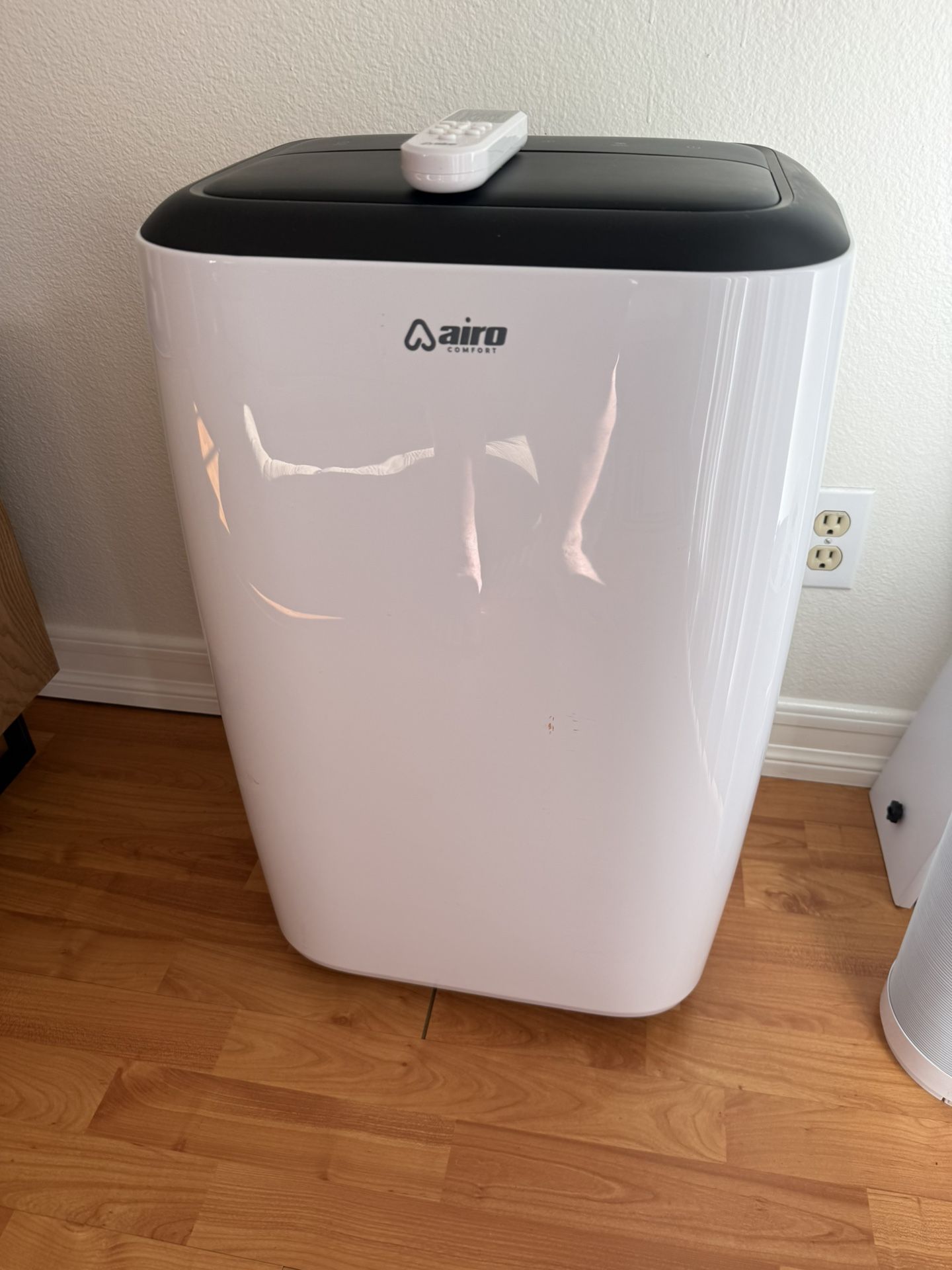 AIRO COMFORT - 14,000 BTU (10,000 BTU DOE) Portable Air Conditioner Cools 700 sq. ft. with Dehumidifier and LCD Remote in White AIRO COMFORT - 14,000