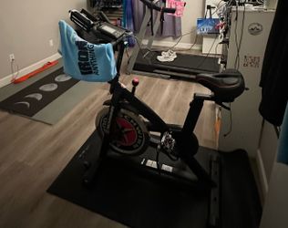 Schwinn IC3 Indoor Cycling Bike with upgraded comfort seat and protective floor mat included.