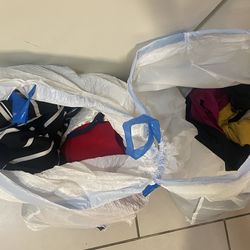 2 Bags of women’s clothes (size small)