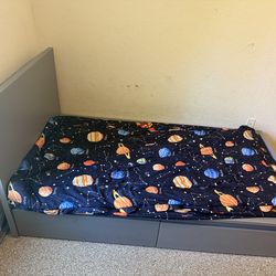 Grey twin size bed with under drawers