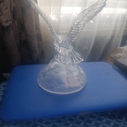 Crystal eagle scooping up a fish piece