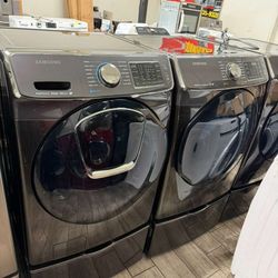 Samsung black stainless steel washer and dryer set with pedals warranty included