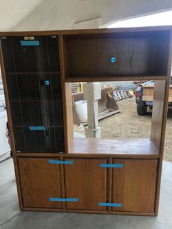 Wood entertainment center with glass doors