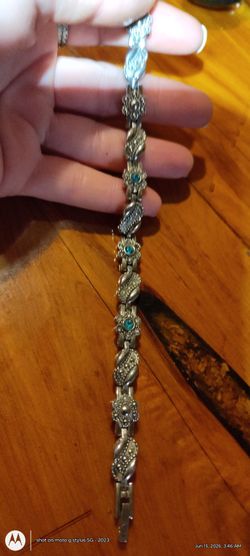 7" ladies stainless steel linked wemons bracelet with baby blue colored stones perfect condition