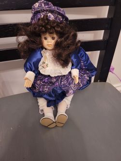 Windup porcelain doll
