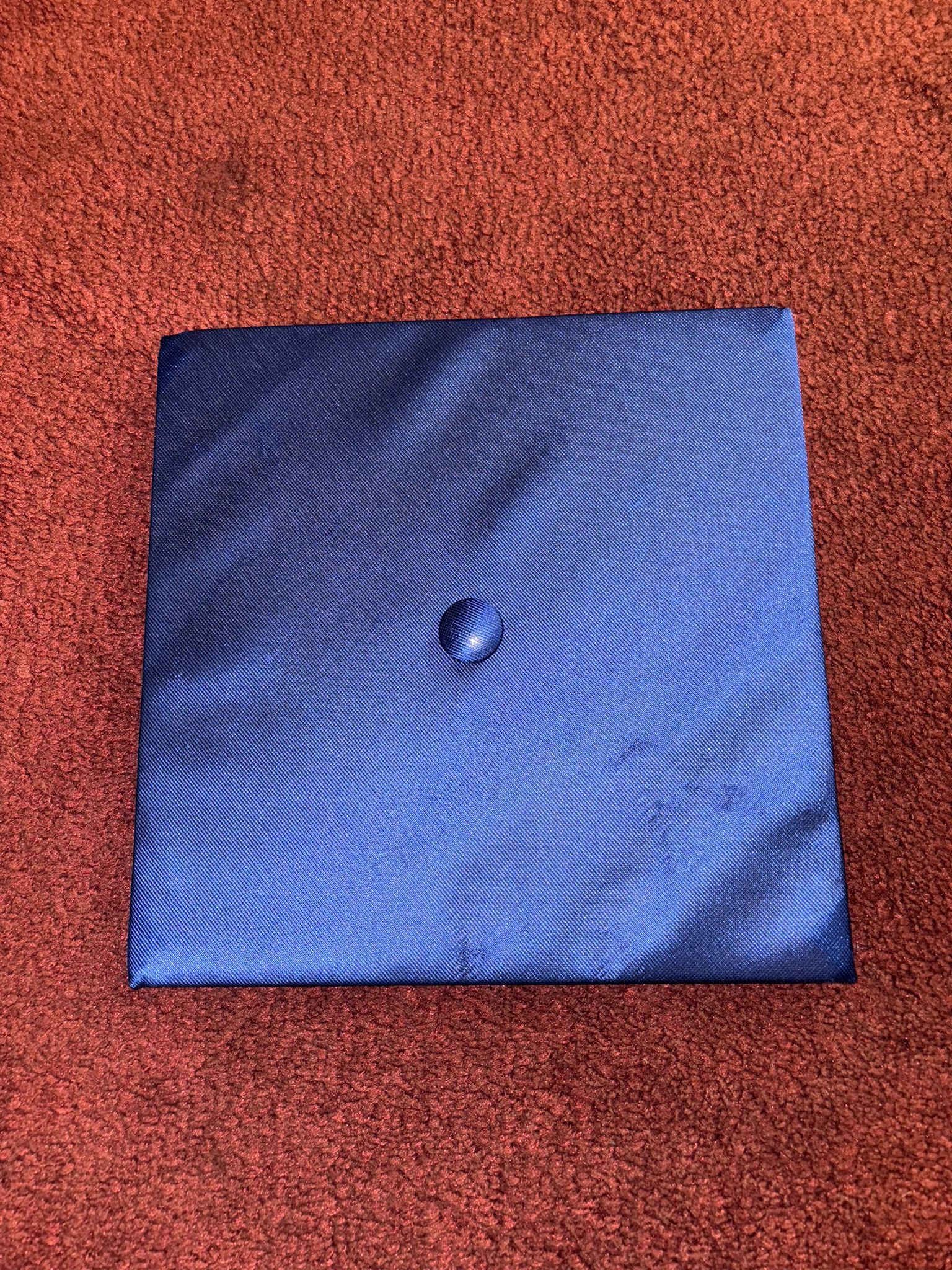 Blue Graduation Cap • Description: Classic blue graduation cap with an elastic band for fit. • Brand: Herff Jones