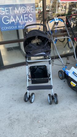 Pet stroller (a collapsible 4-wheel dog and cat carrier or travel cart).