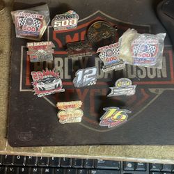 Miscellaneous race pins including number 16 Greg Biffle