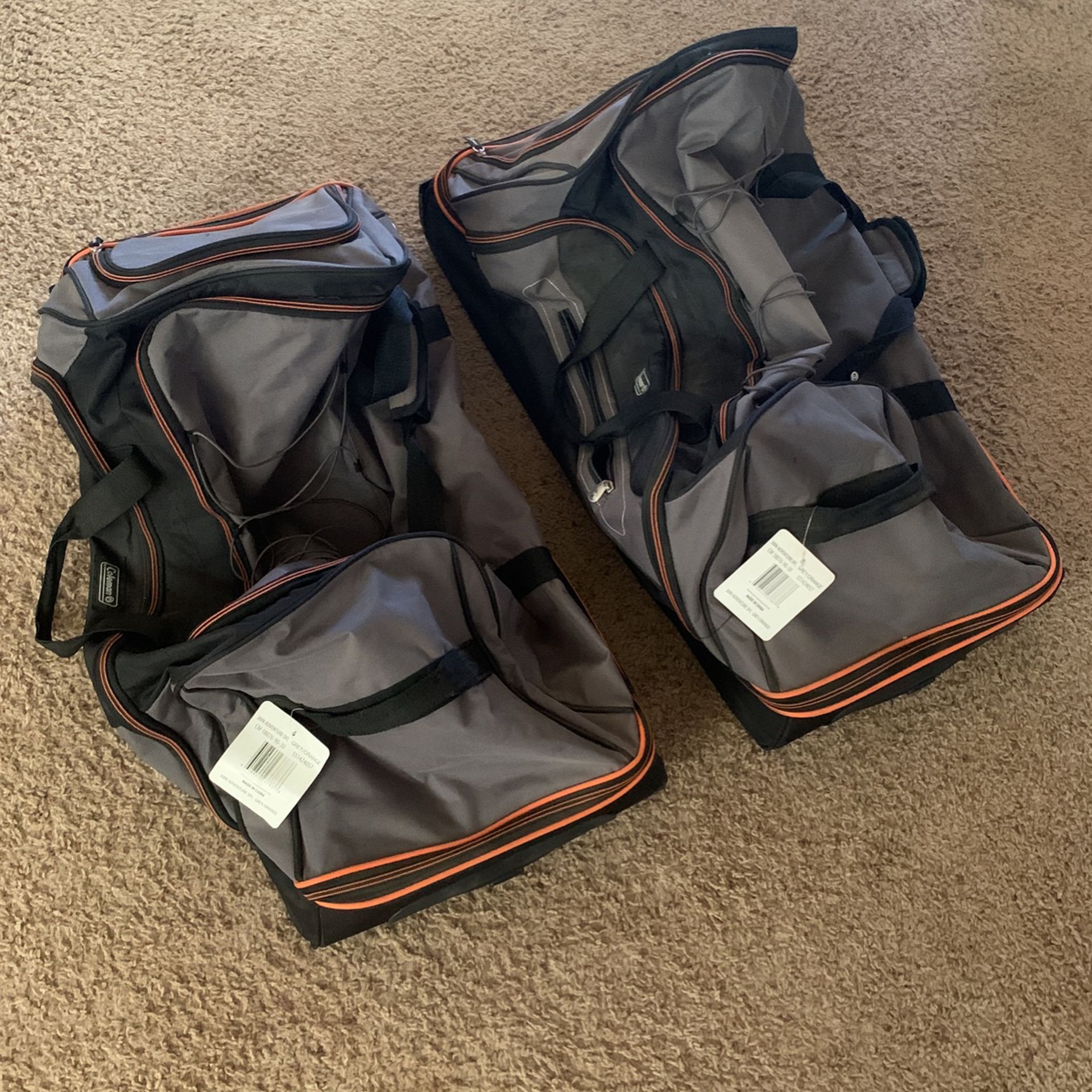 Two Large Rolling Coleman Duffle Bags