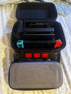 Nintendo Switch with Dock, Games, and Carrying Cases