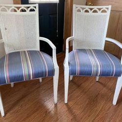 Pair of upholstered cane back arm chairs 