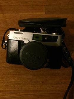 Vintage Petri 7s 35mm camera with two extra lenses with lens cap and case