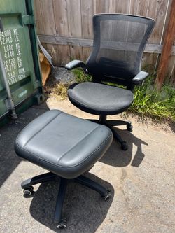 Comfy office chair and footrest under desk
