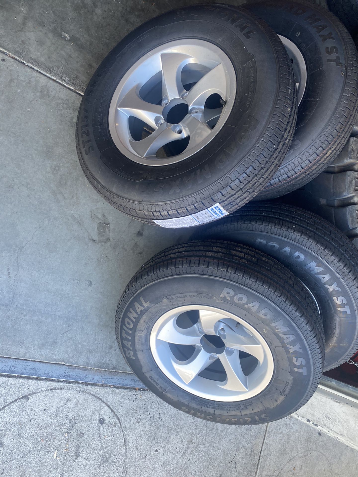 New 4x ST trailer tire 215x75-14 with silver rim $600 No reply if you lowball
