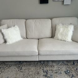 ‏beige sofa