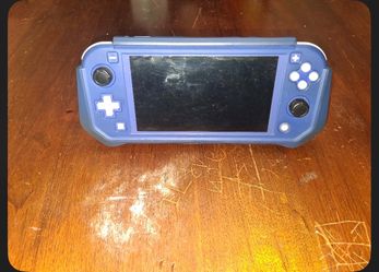 Nintendo Switch Lite with three games