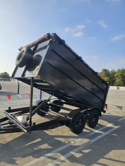 NEW DUMP TRAILER 12X8X4 12000 LBS
ROLLING TARP--SPARE TIRE,ELECTRIC BRAKES,HYDRAULIC SYSTEM,REMOTE CONTROL,IDEAL FOR HAULING, DEMOLITION, TRASH ETC, 