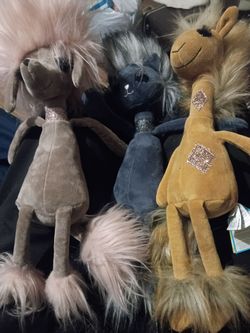 Jellycat dolls, cat, dog, and giraffe