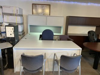 Light gray u-shaped desk with hutch task light and keyboard tray