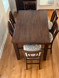 solid wood dining table with 8 chairs