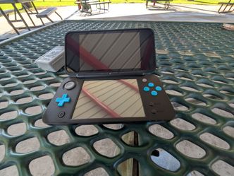 New 2ds XL with a 64gb memory card with games for sale or trade