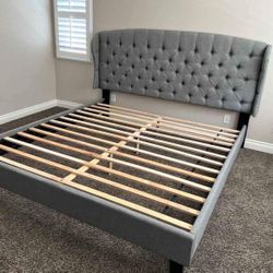 Brand new king size grey linen upholstered platform bed frame.