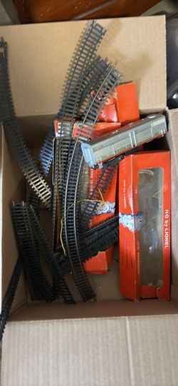 Box Of Lionel Train Tracks And One Train 