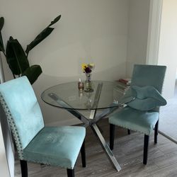Glass table and teal velvet chair set 
