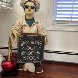WAITER HOLDING SPECIALS SIGN HOLDING BASKET
