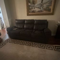 Reclining black leather couches