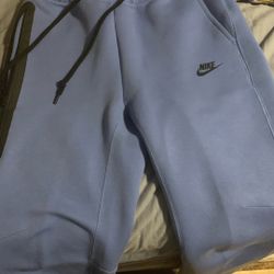 blue nike tech hoodie with it